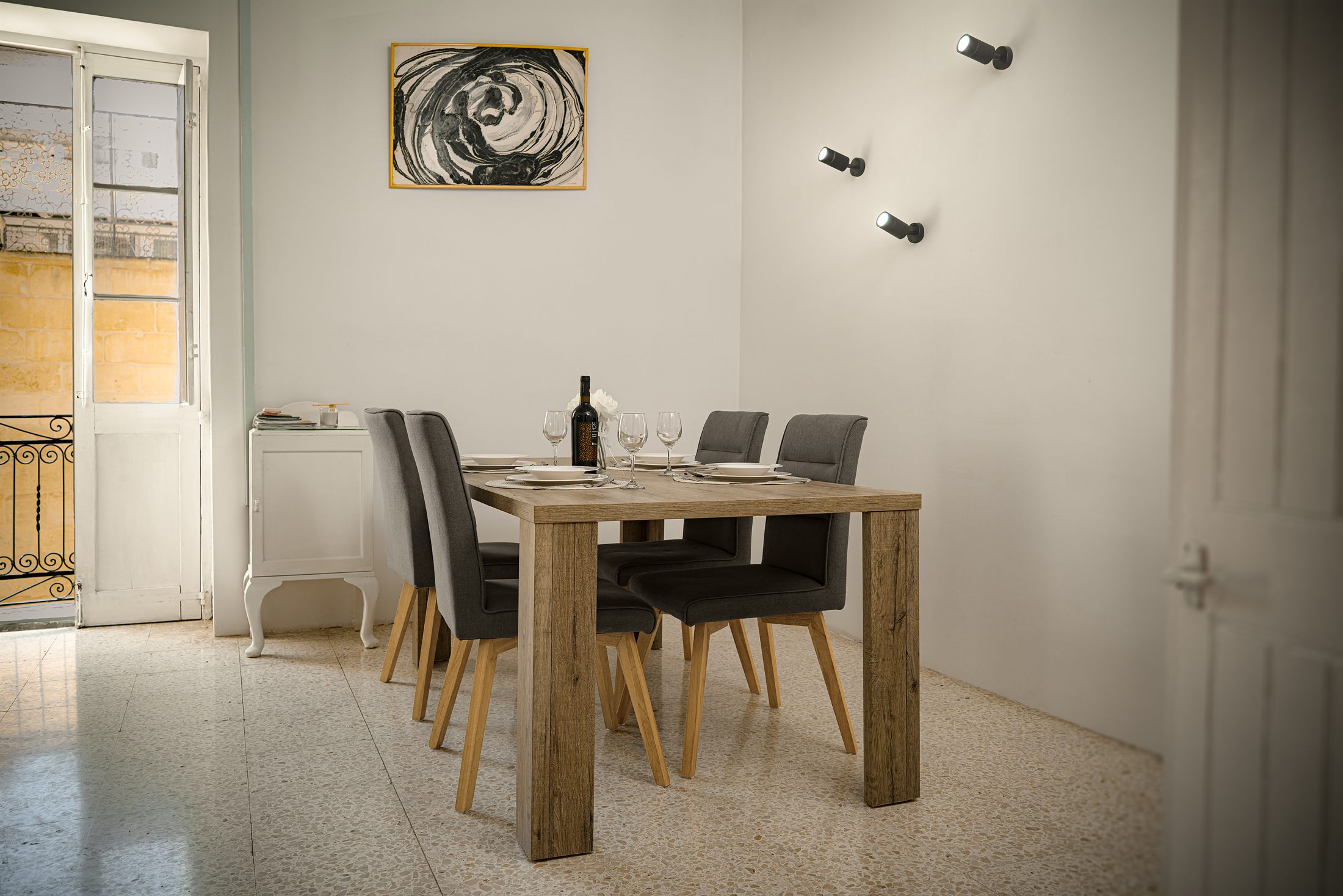 Valletta Old Town Balcony · Charming 2BR — dining area with the balcony door open